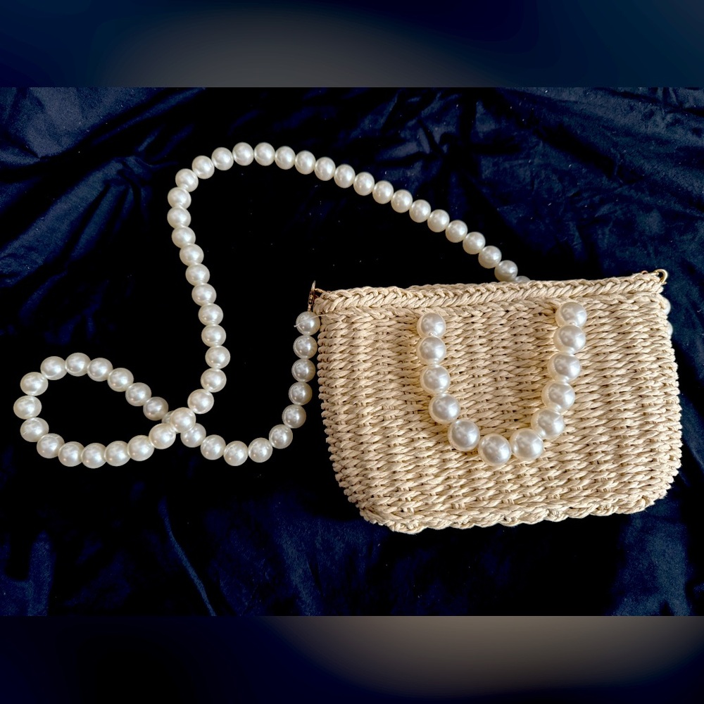 Woven handbag w/Pearl handles and strap. Measures 6 x 9 inches. Never used.